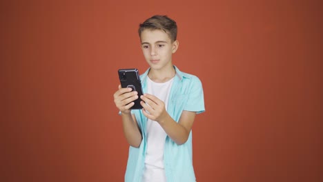Boy-making-a-video-call-on-the-phone.