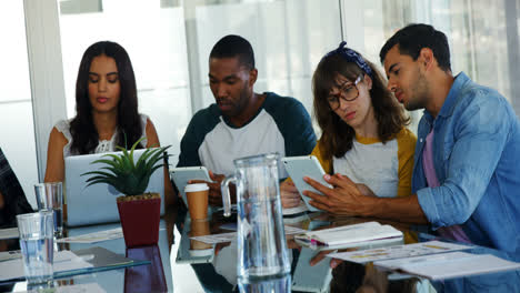 executives using laptop and digital tablet