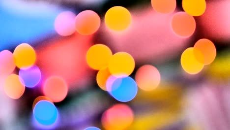 blurred colorful lights. red, green, yellow, orange, blue defocused glittering bokeh festive background.