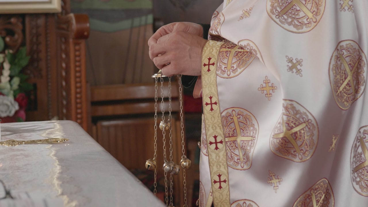 Orthodox Priest Holding Censer During Religious Service
