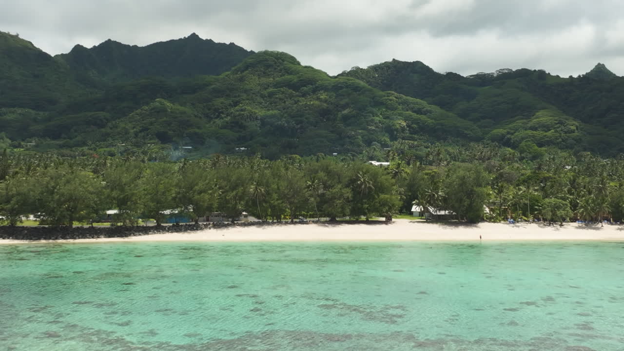 Drone tracking left of Aroa Beach Lagoon Marine Reserve in South Pacific, Rarotonga Cook Islands