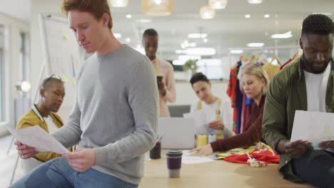 Diverse-group-of-male-and-female-business-colleagues-working-in-office