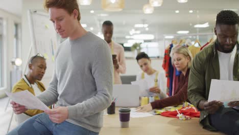 diverse group of male and female business colleagues working in office
