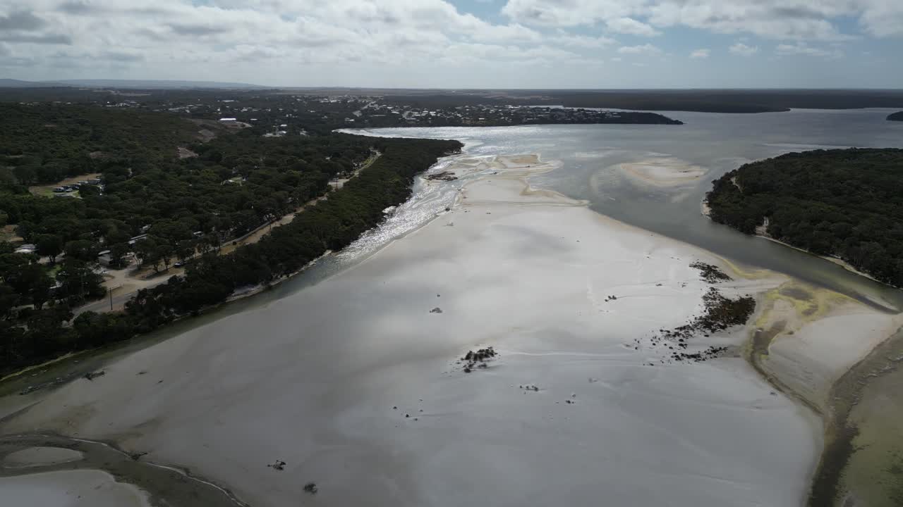 Cinematic Shot Of River Water Merging With Ocean Water, Australia