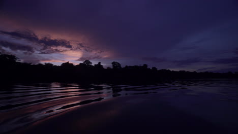 night time pan shot across the amazon river