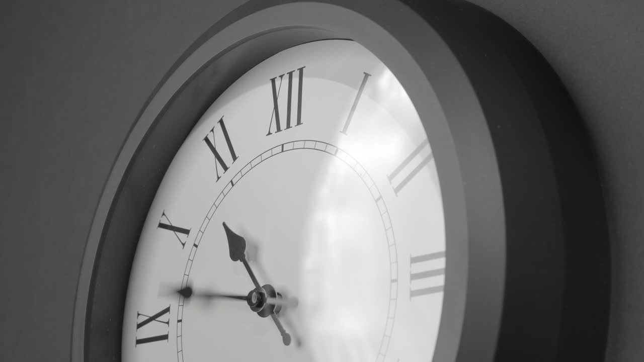Latin Clock Face in Time Lapse on Dark Grey Wall