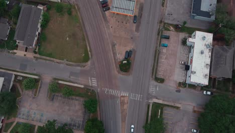 Aerial-of-cars-driving-on-city-street-in-Houston,-Texas