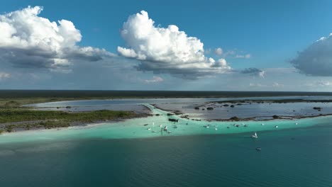 aerial view approaching yachts at the pirates channel, in the laguna bacalar, sunny mexico