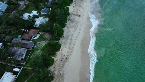Aerial-drone-shot-of-waves-and-swells-hitting-the-beach