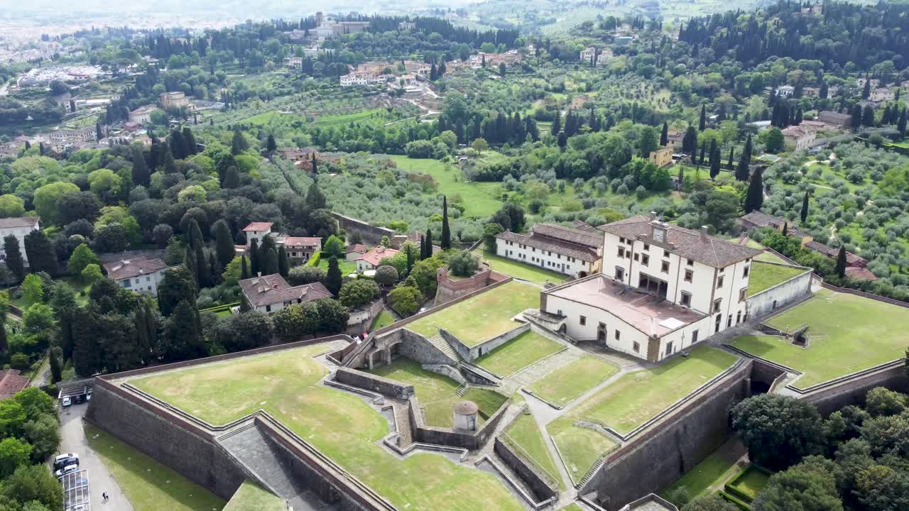 Aerial pan of Forte di Belvedere and lush Boboli Gardens in full greenery