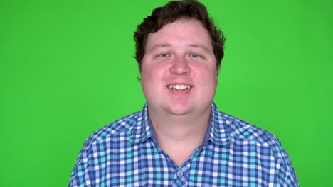 portrait of happy people with emotions and feelings. fat young man smiling at camera with joyful smile.