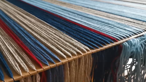 Wool-yarns-disposed-in-the-process-of-weaving-to-make-a-blanket