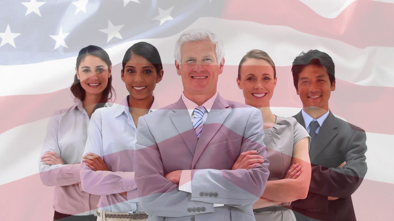 Biz team posing in studio, flag motion starting, drifting across team and ending covered for brand