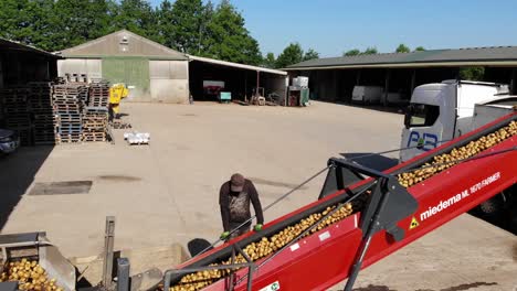 potato grader machine from aerial side view and a farm yard