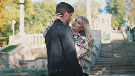 romantic man kiss woman with long blond hair