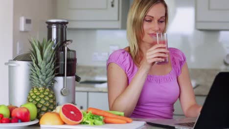 blonde drinking fresh fruit and vegetable juice