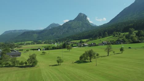 Cinematic-drone-sweeps-left,-unveiling-Austrian-splendor:-Wolfgangsee-lake-and-the-majestic-Bleckwand-mountain