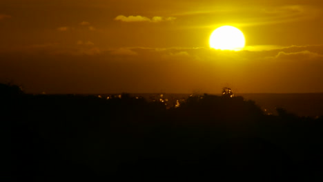 The-sunset-behind-waves-as-they-crest-and-break-in-slow-motion-at-sunset-4