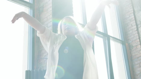 woman dancing indoors