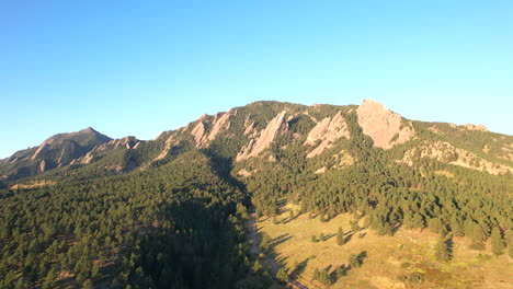 aerial drone pan of the flat irons nature area and chautauqua park in the morning