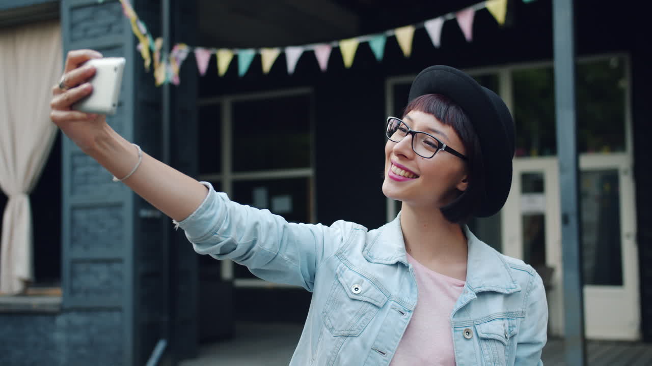 Happy Woman Taking a Selfie on the Street