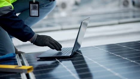 engineer working on a solar panel system with a laptop