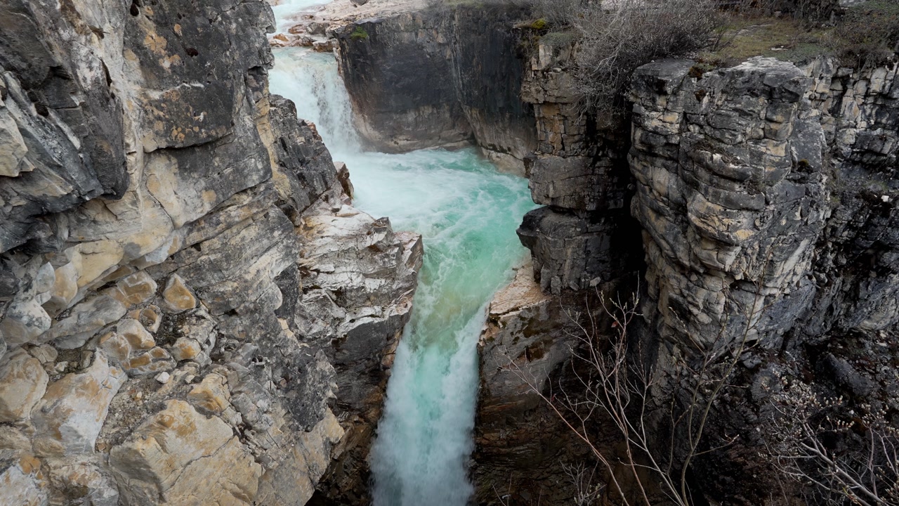 Marble Canyon waterfall flowing through Kootenay National Park in Canada