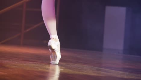 close up ballet dancers feet , dance floor footage closeup , point shoes, black costume, ballet choreography