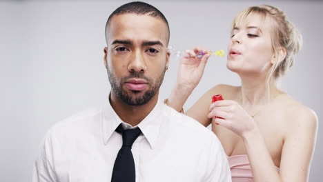 couple blowing bubbles slow motion wedding photo booth series