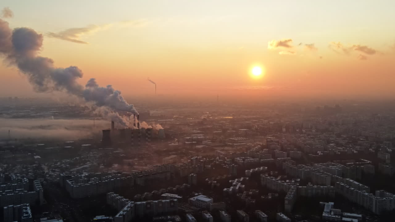 Cityscape of Bucharest from a drone, rows of residential buildings, thermal station with fog getting out and other the ground, ecology idea, Romania