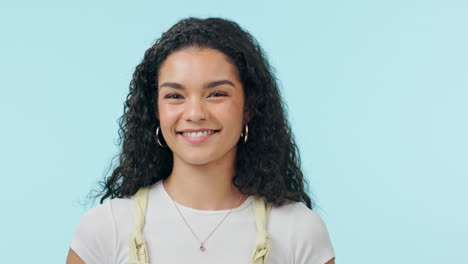 Wink,-woman-and-face-in-studio-with-smile