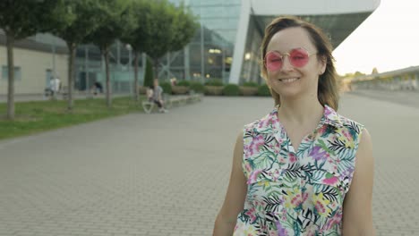 Woman-tourist-walking-with-luggage-from-airport.-Girl-smiling,-rejoices.-Vacation,-trip,-holidays