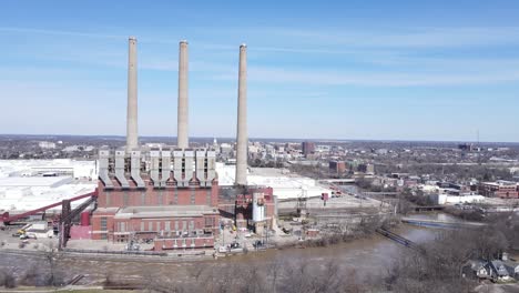 closed coal power plant in michigan, aerial drone orbit view