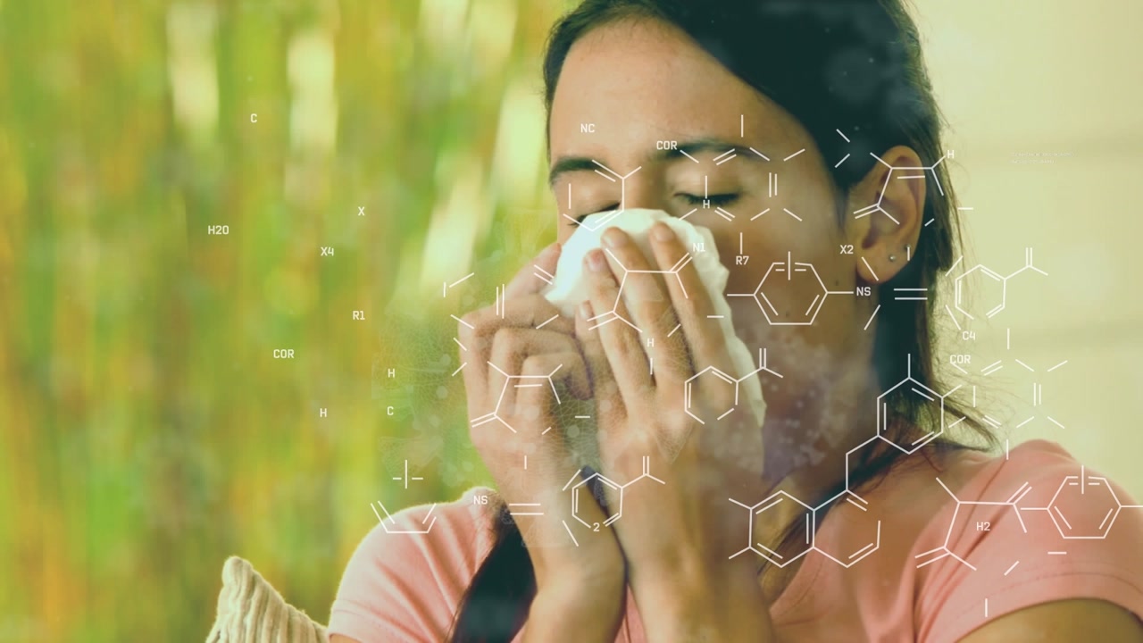 Animation of chemical formulas over sick caucasian woman having running nose