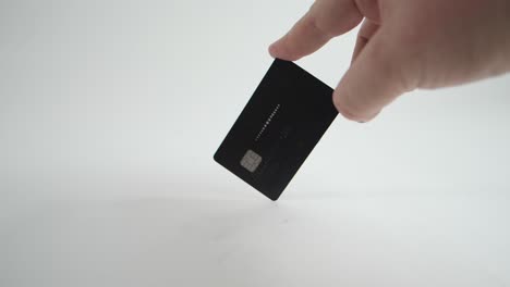 slow-motion of a credit card being spun with a white background