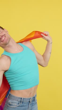 man with lgbtq rainbow flag