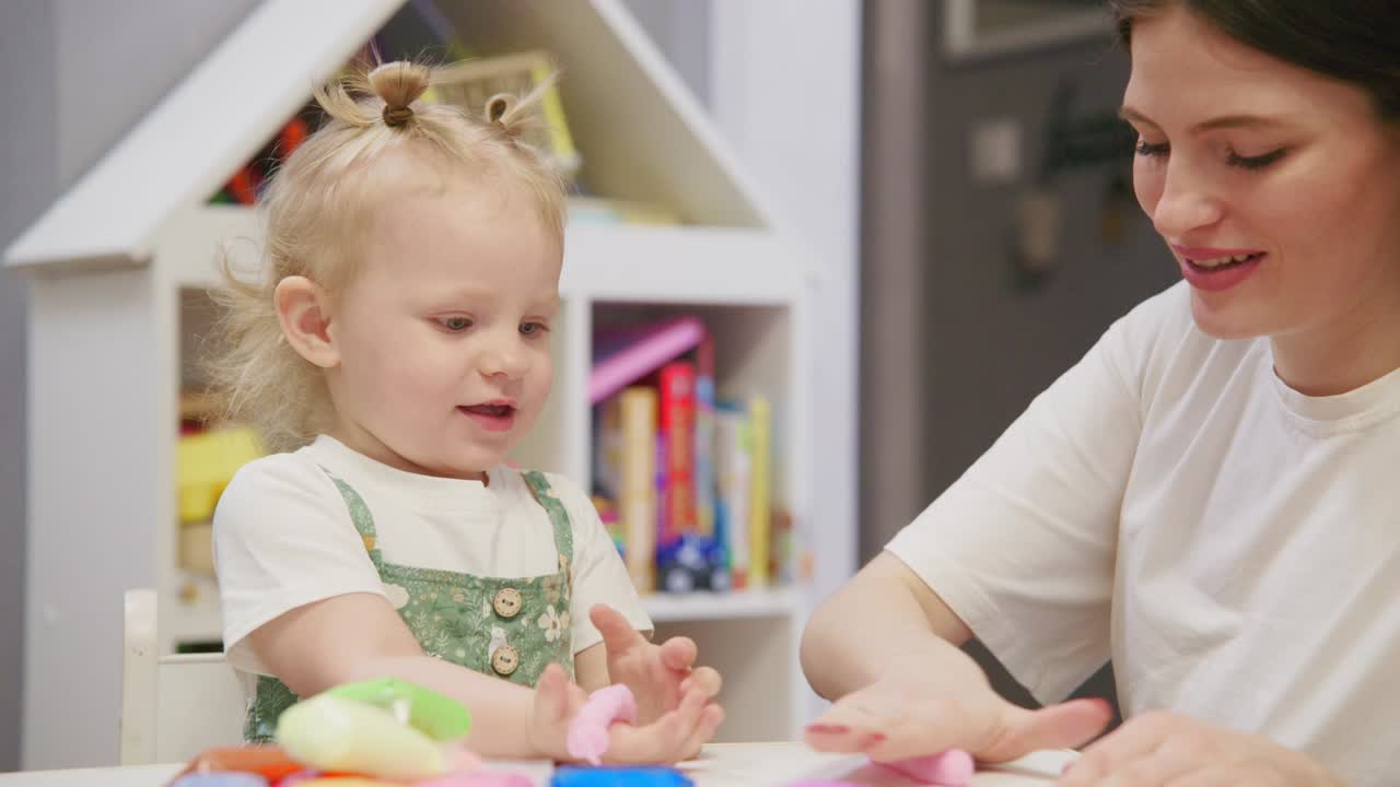 Young Mother and Toddler Playing with Colorful Modeling Clay