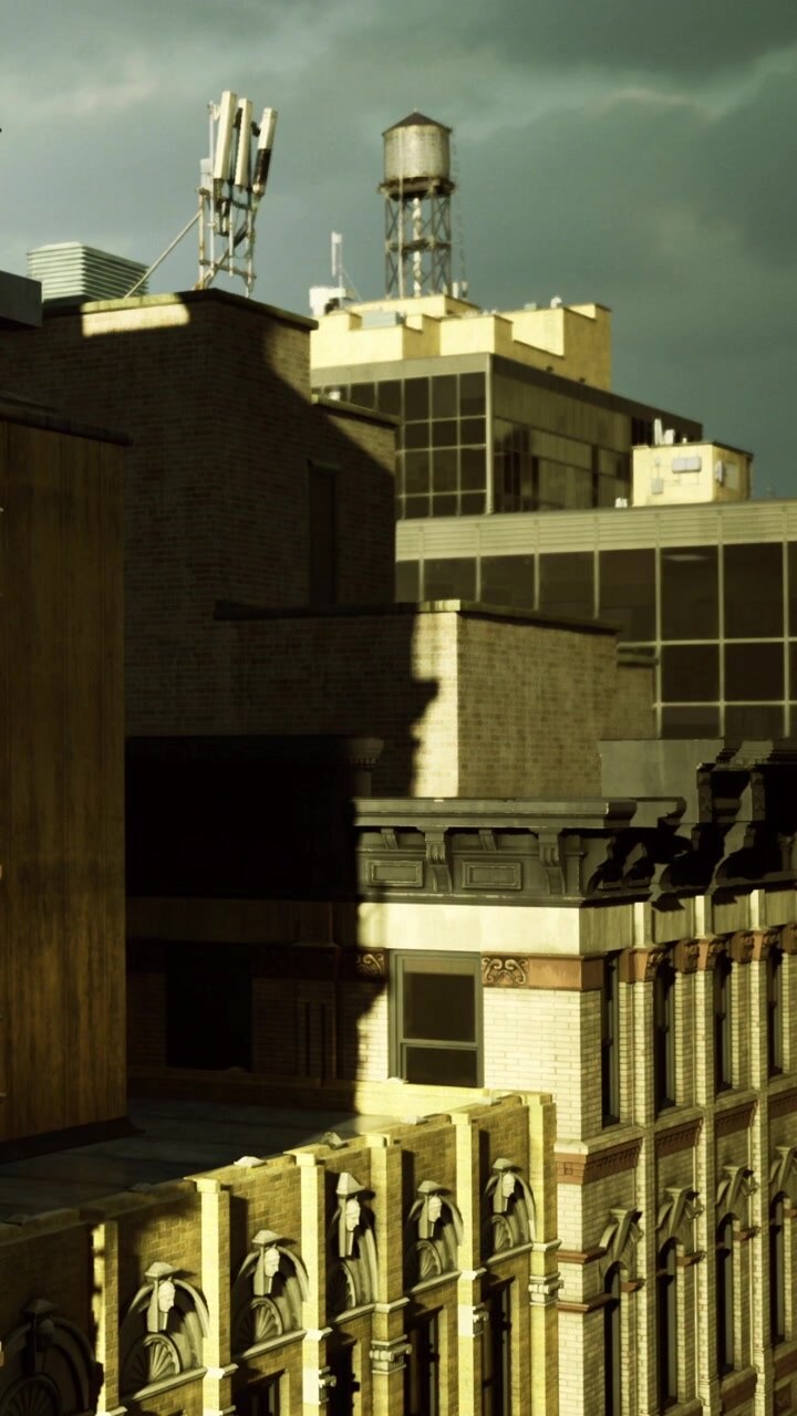 Edifici in un contesto urbano di giorno con ombre e strutture visibili.