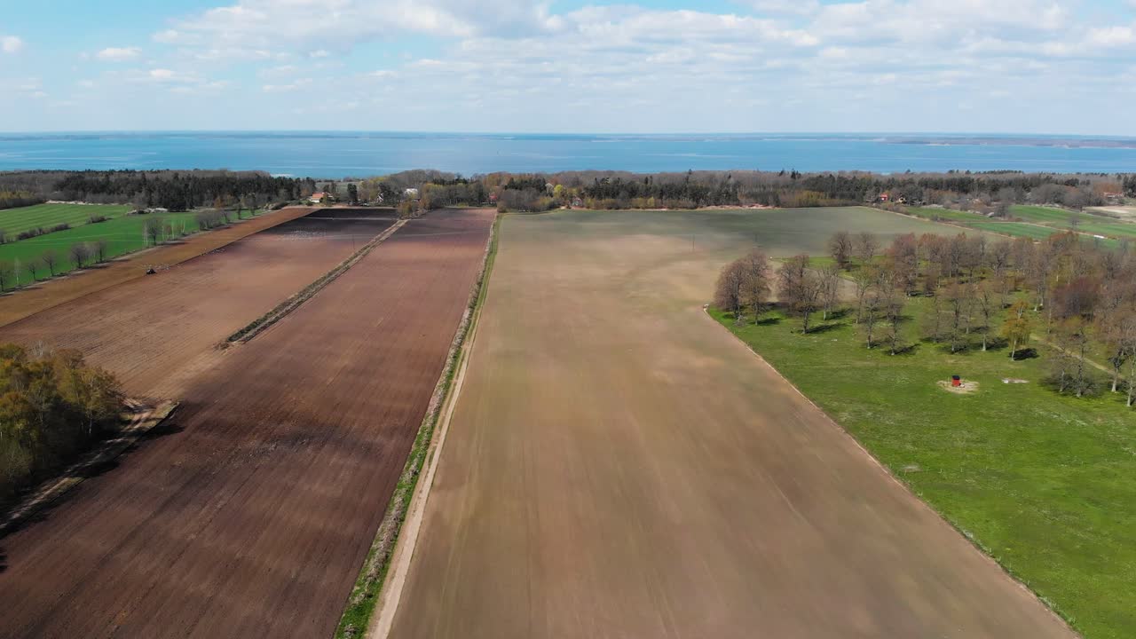 Aerial Drone Flying Over Oland Island's Agricultural Farms and Kalmar Strait