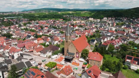 aerial view of a charming german village with church and outdoor event