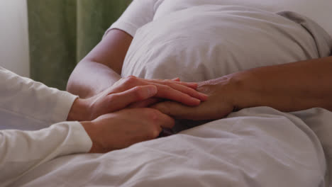 nurse helping a senior woman in a retirement home