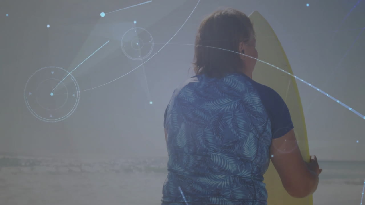 senior woman standing on sandy beach holding surfboard, with animated technology flares and overlay