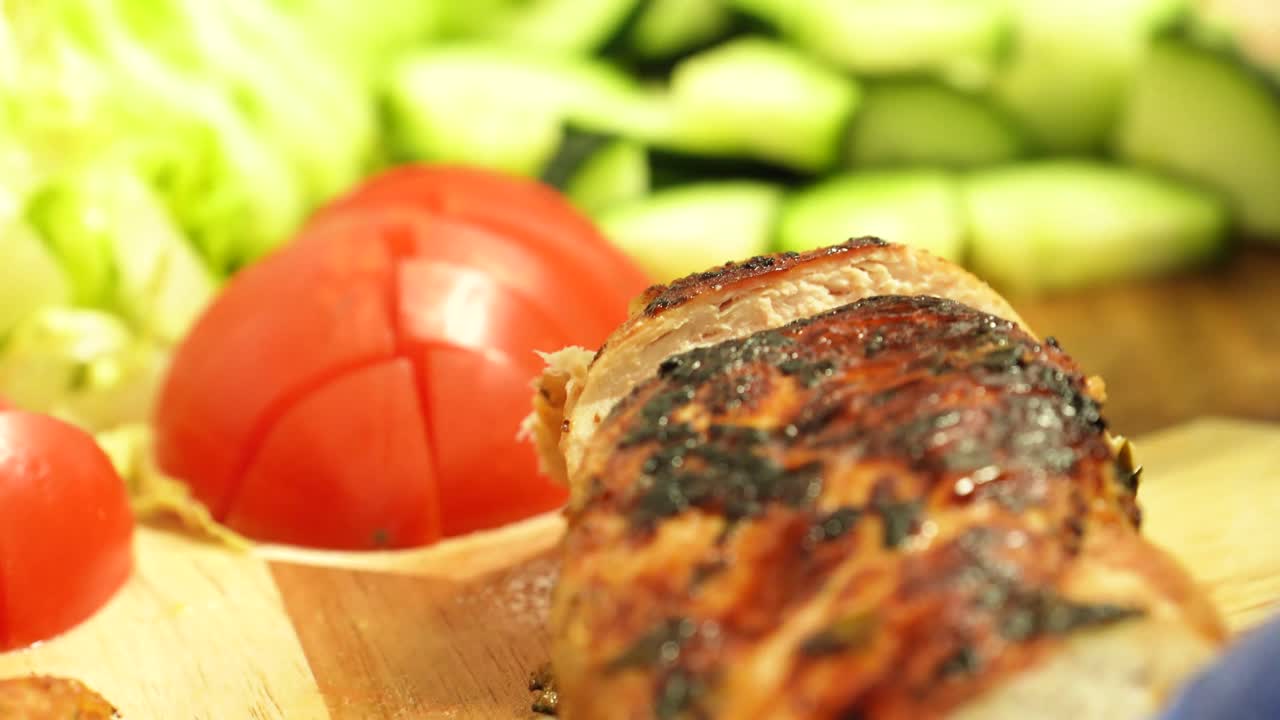 Slicing Roasted Chicken Breast Meat For Vegetable Salad Toppings While Wearing Blue Rubber Gloves - Closeup Shot
