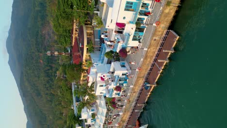 vertical view of the mediterranean-inspired architecture of son tra marina restaurant in da nang vietnam. aerial shot