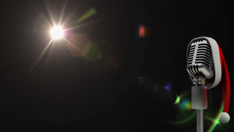 animación de la luz y el micrófono vintage en el sombrero de santa sobre fondo negro