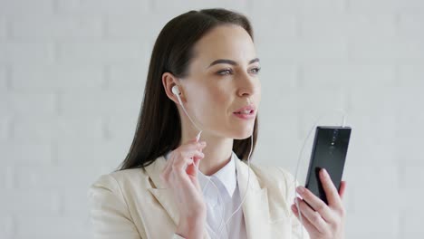 businesswoman listening to music