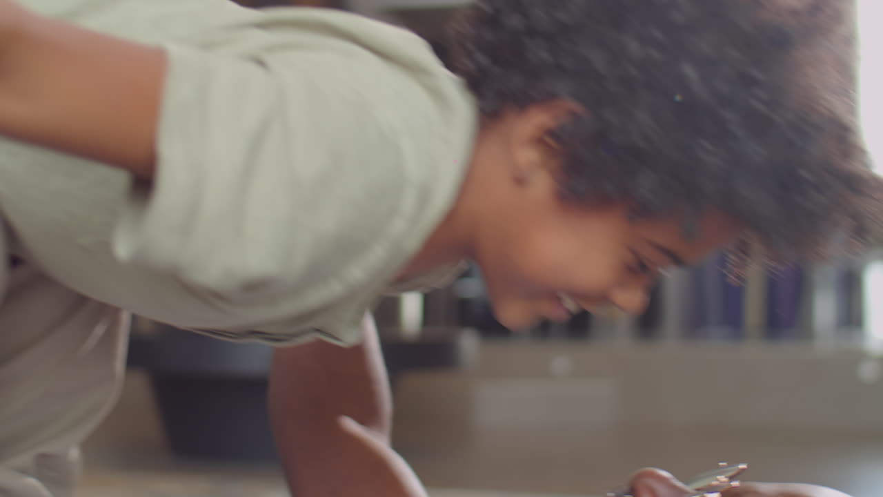 Little Boy Playing with Father at Home