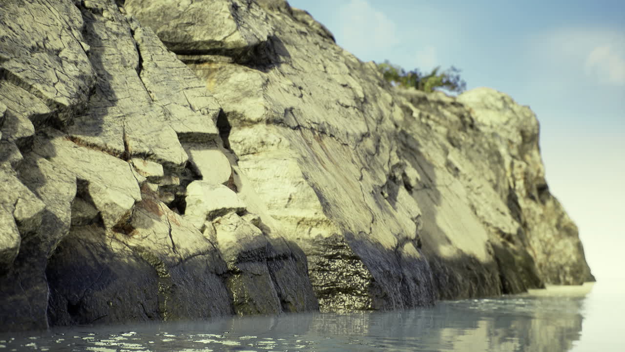 Rocky shore with calm waters reflects serene coastal landscape