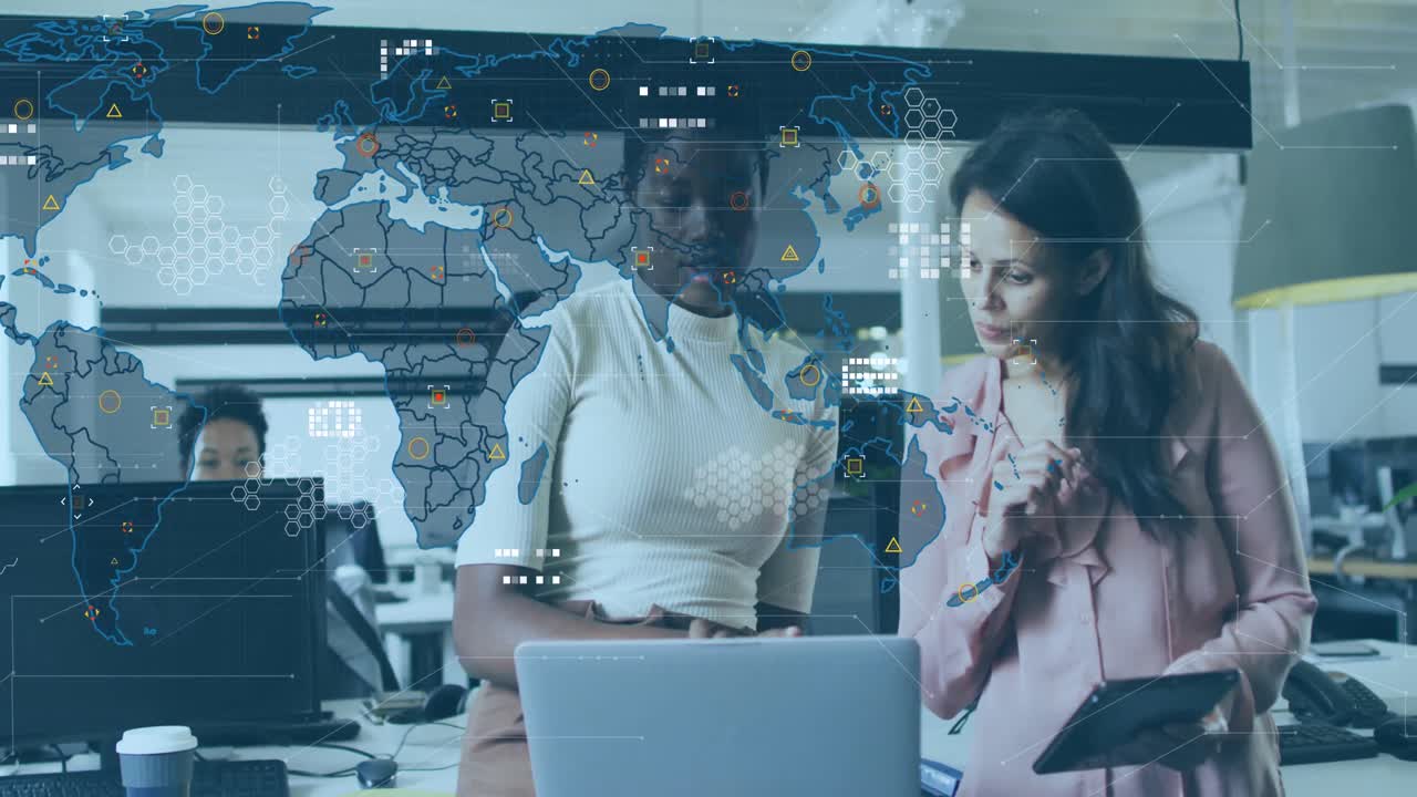 Animation of world map and icons over diverse female coworkers in office