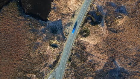 top down spin view of scottish highland road traffic near loch loyne scotland